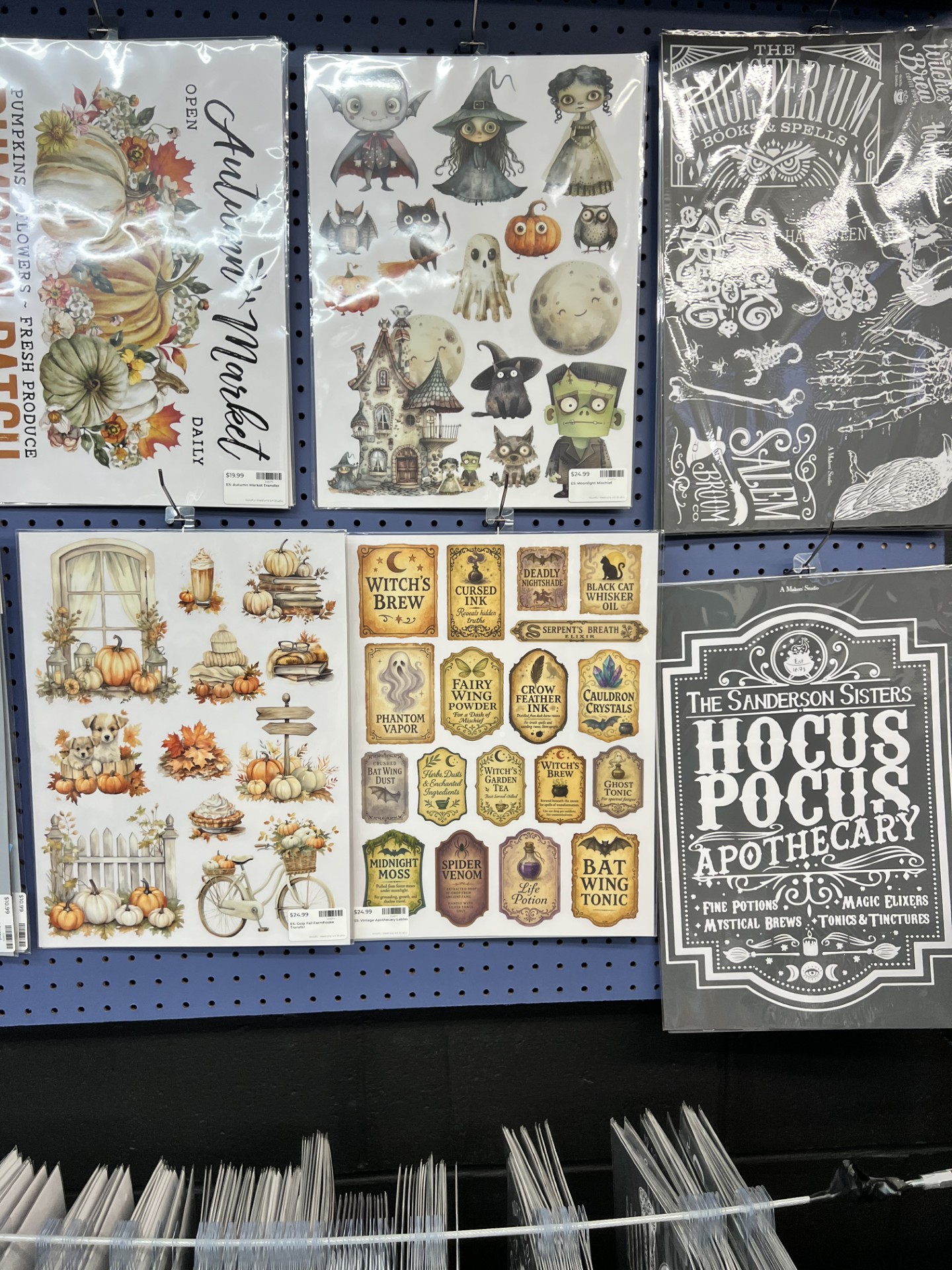 Women creating colorful spring wreaths at a craft workshop.