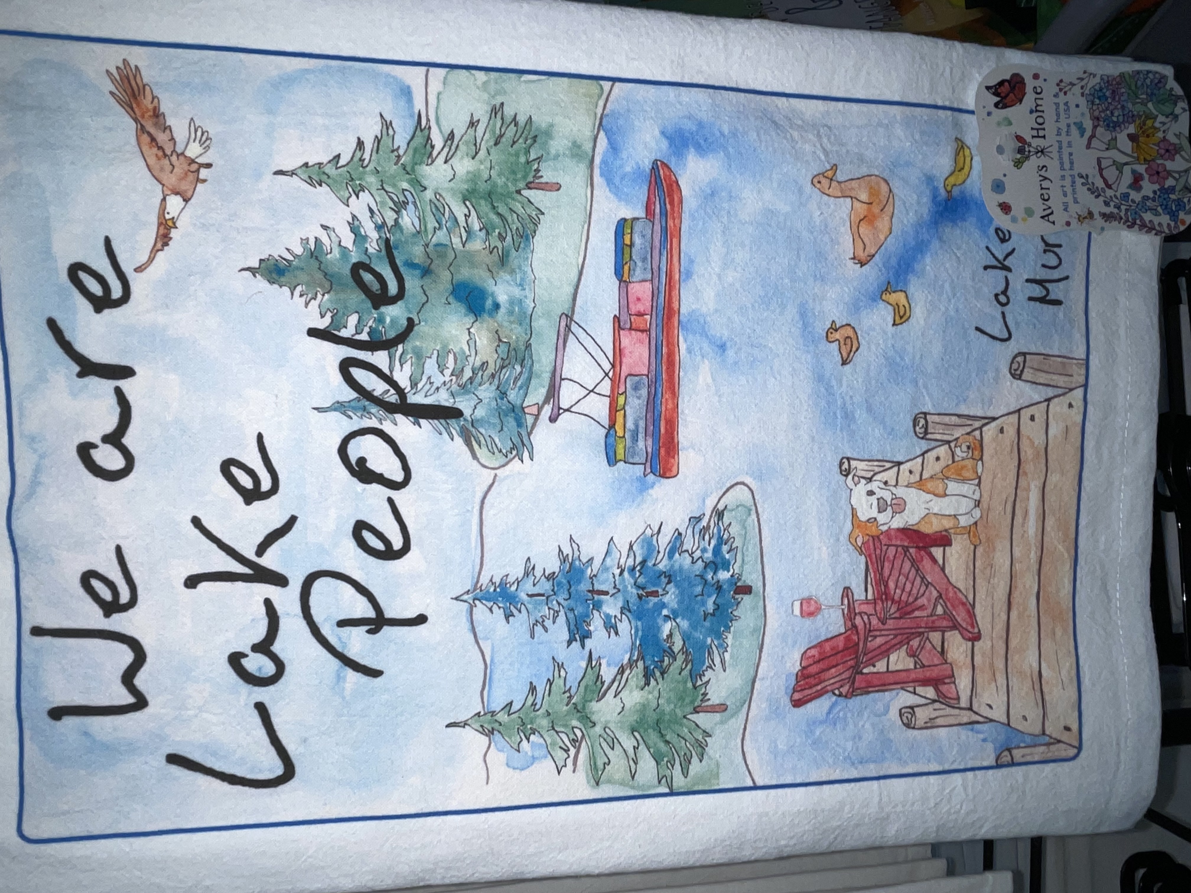 Bee-themed kitchen display with honey jars, mugs, and tea towels