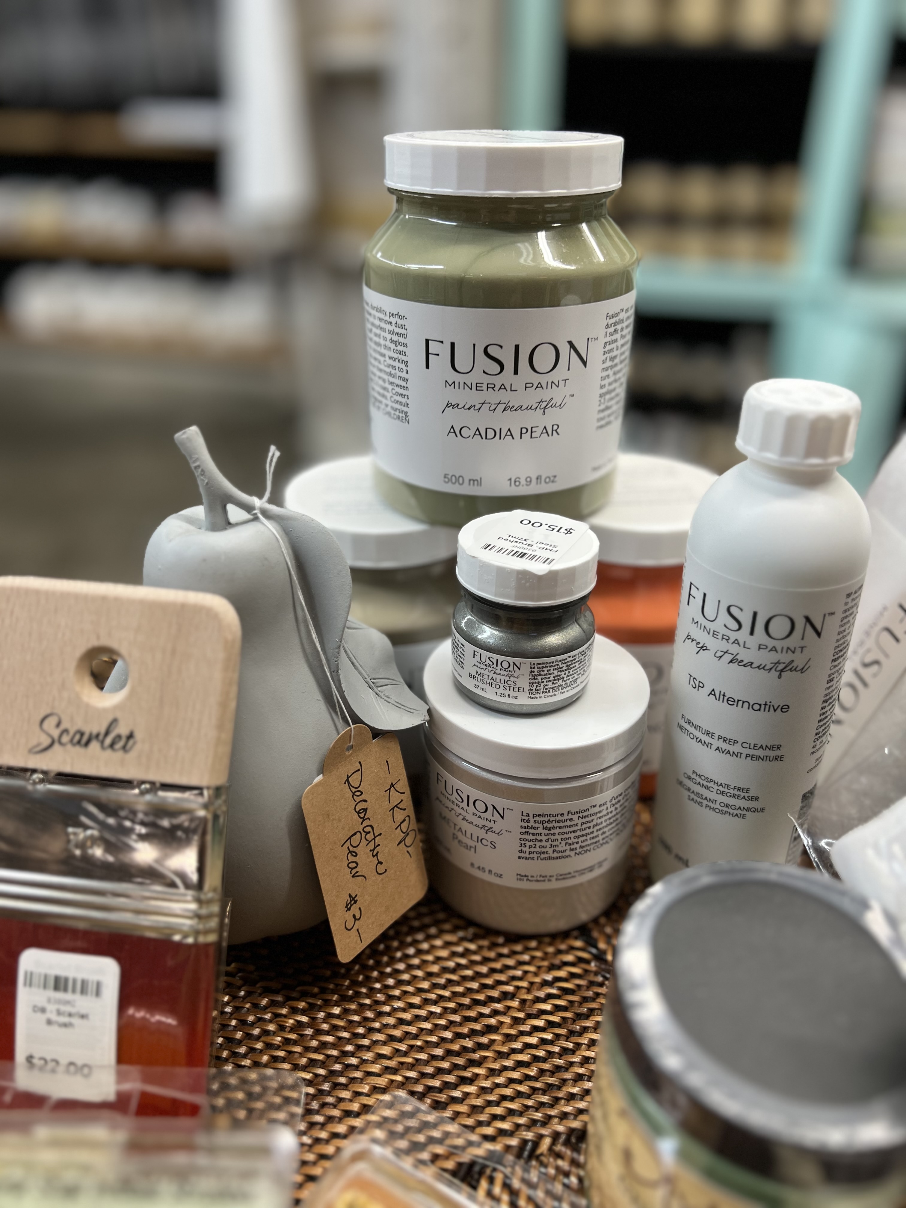 Women creating colorful spring wreaths at a craft workshop.