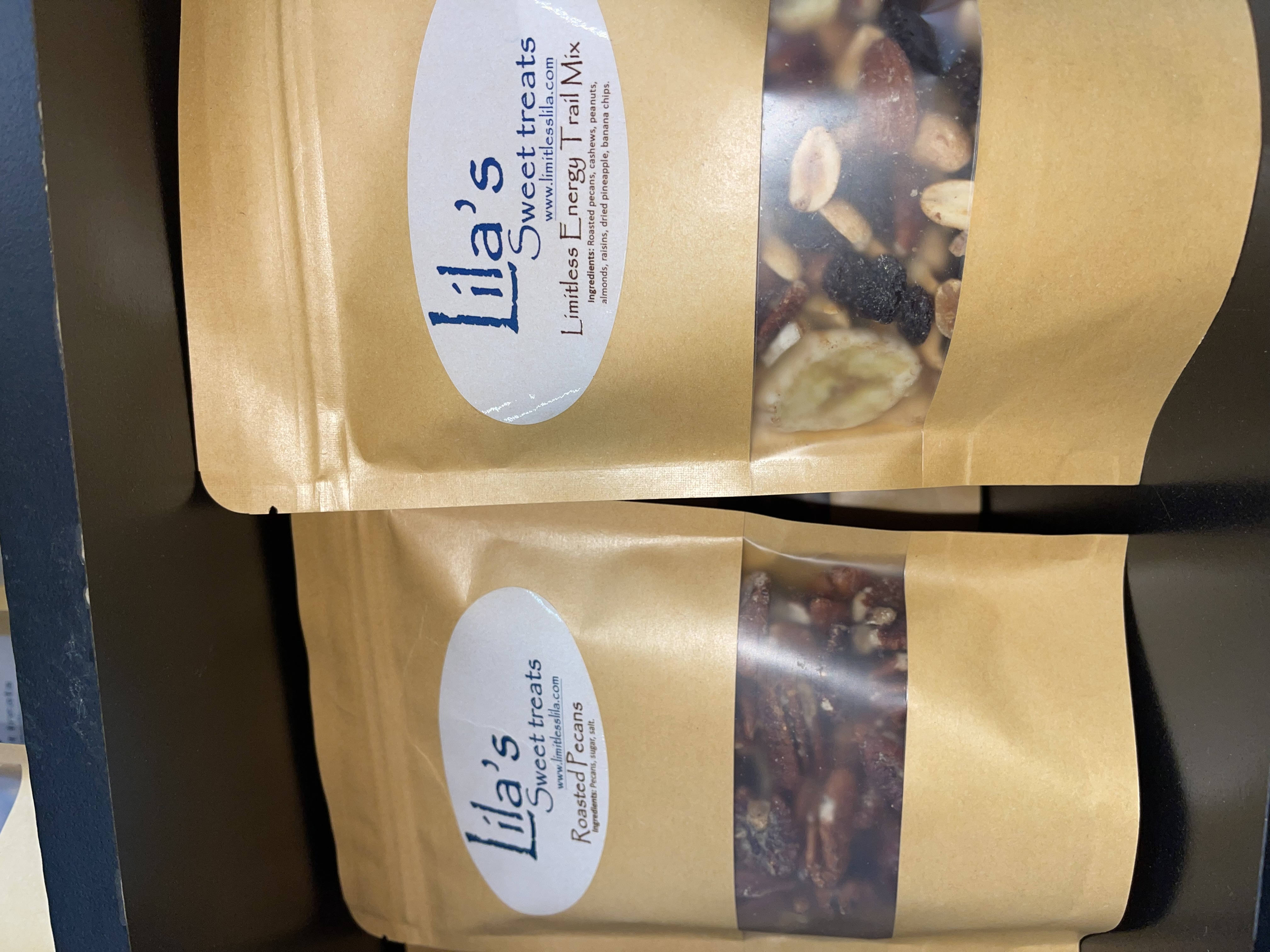 Vendor booth filled with vintage home decor, furniture, and accessories, including lamps, artwork, and dishes.