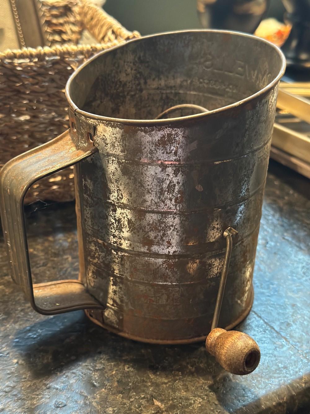 Rusty Bromwell’s flour sifter w/ faux florals