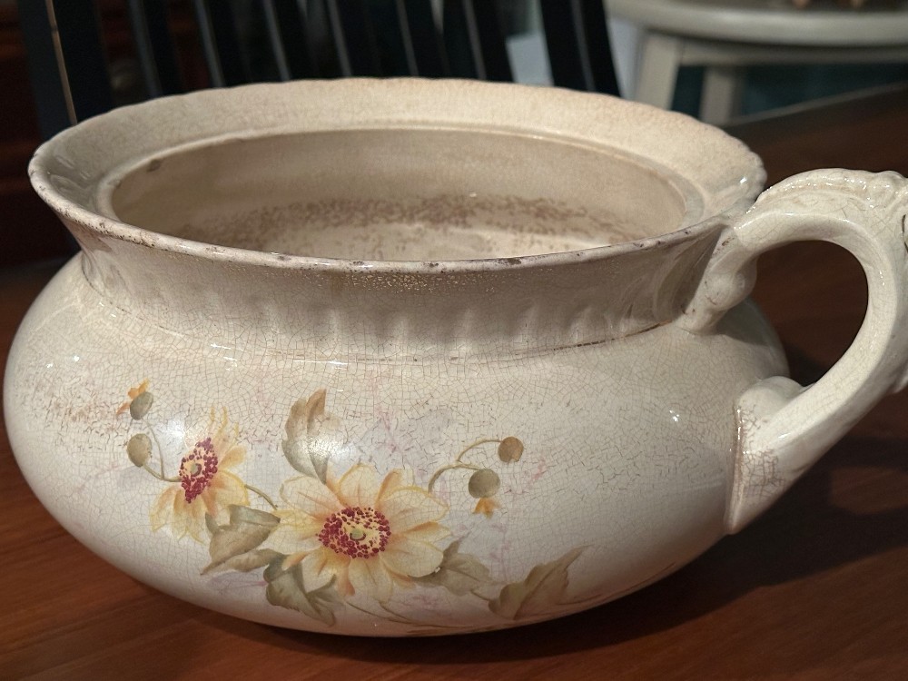 vintage-style cream-colored ceramic chamber pot