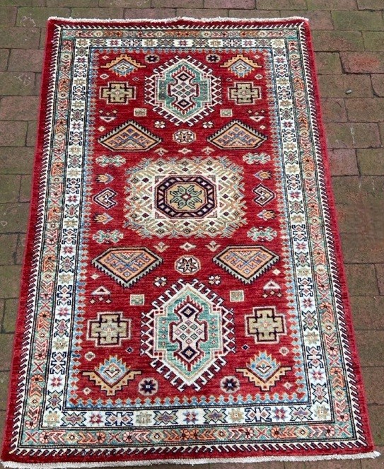 Handwoven Kazak Carpet  Dimensions: 39