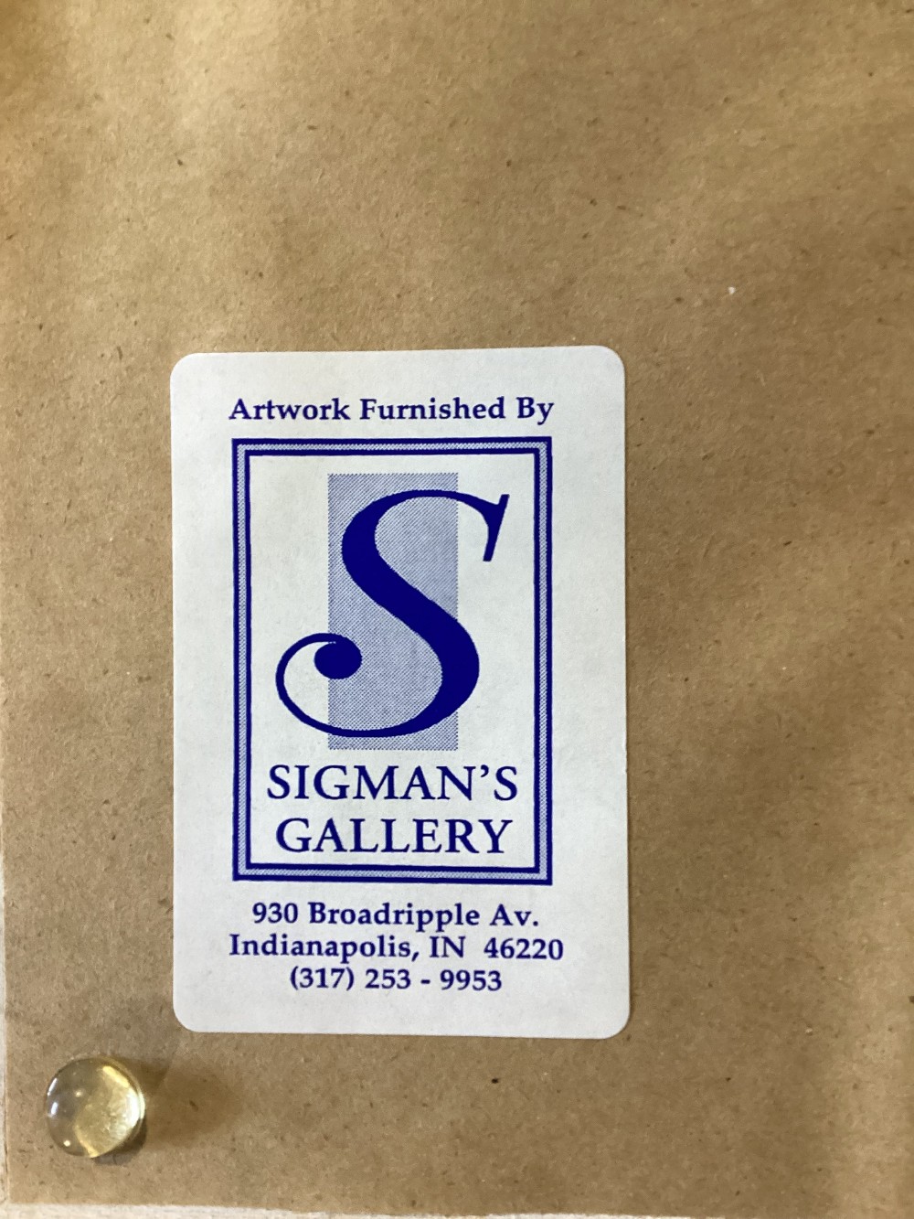 Framed art features a vintage- style needlepoint of a bridge 