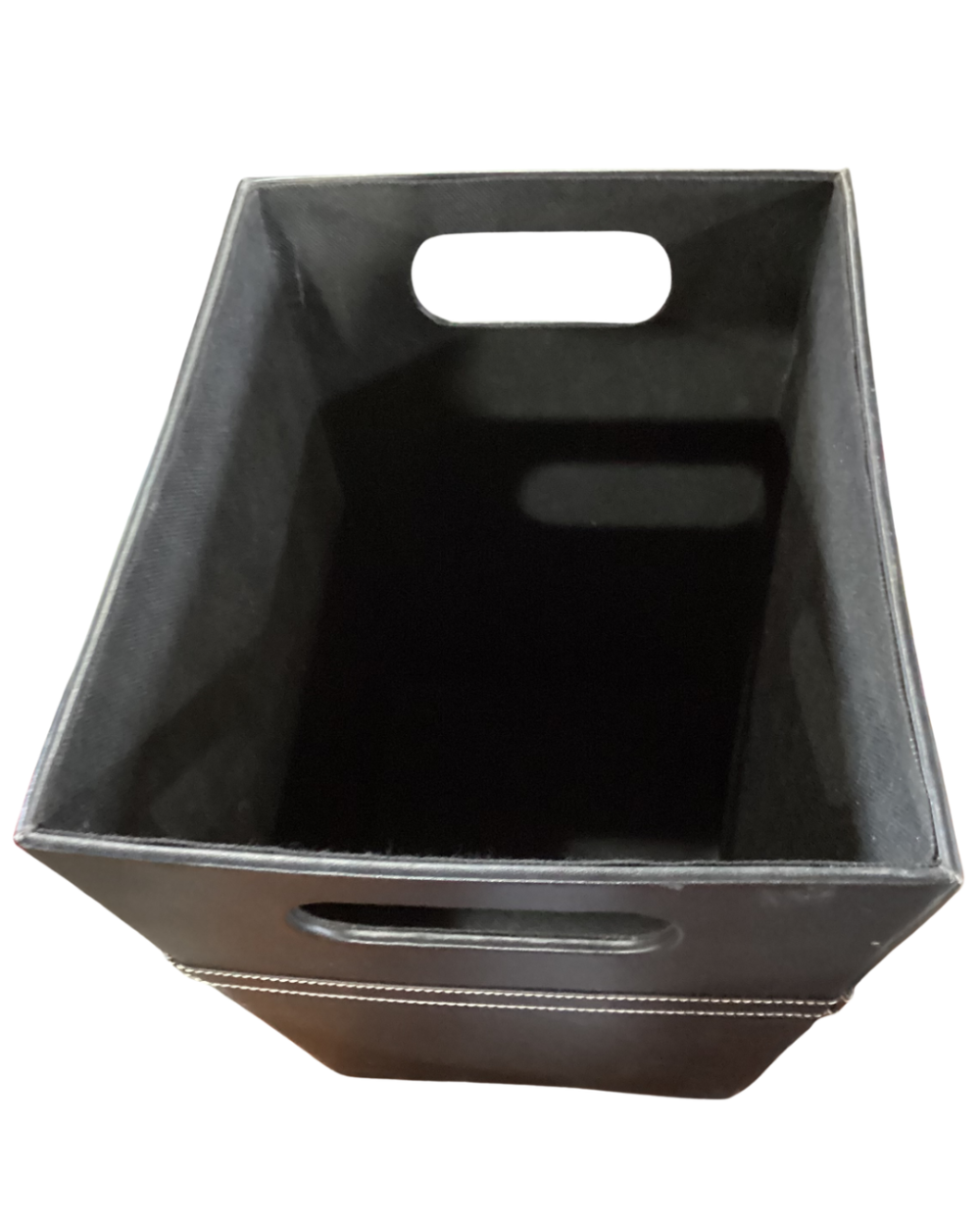 Black faux leather storage bin with white stitching details