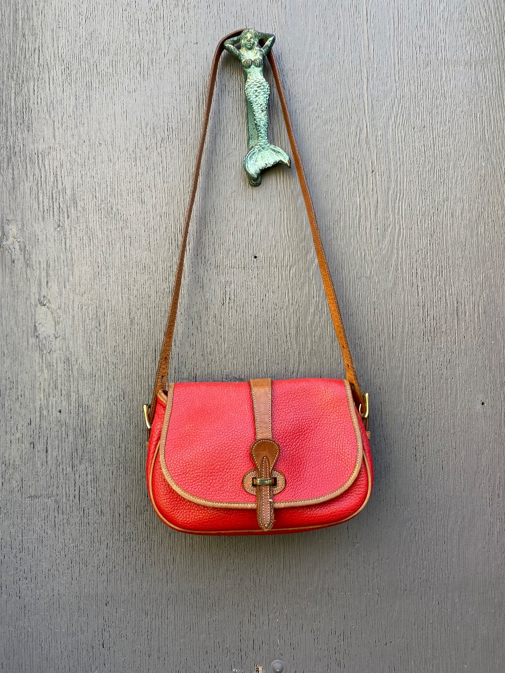 Dooney & Bourke Vintage Tack Saddle Bag in Red