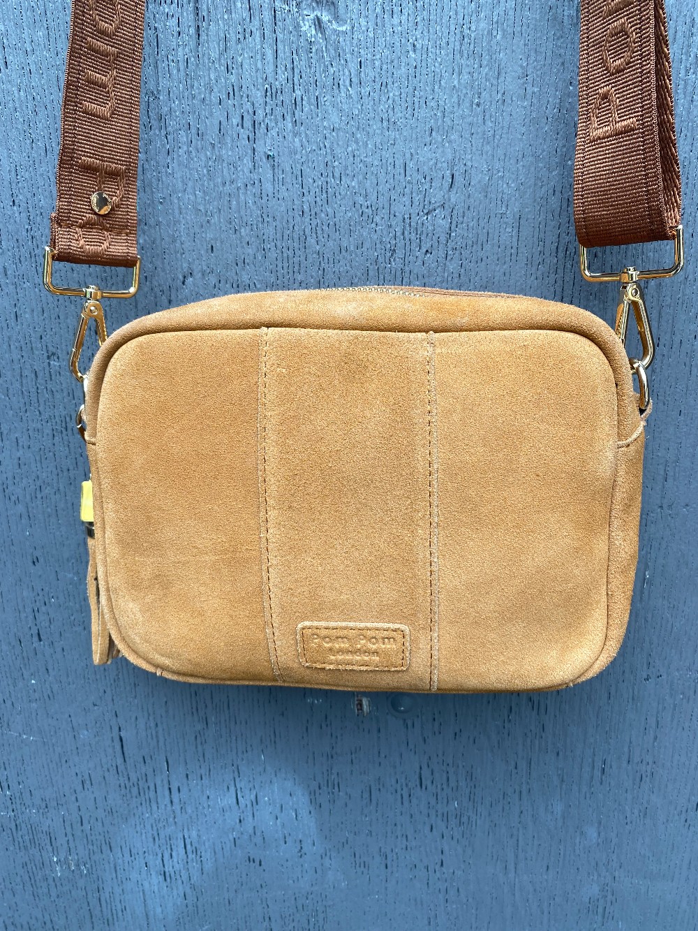 Pom Pom tan suede crossbody