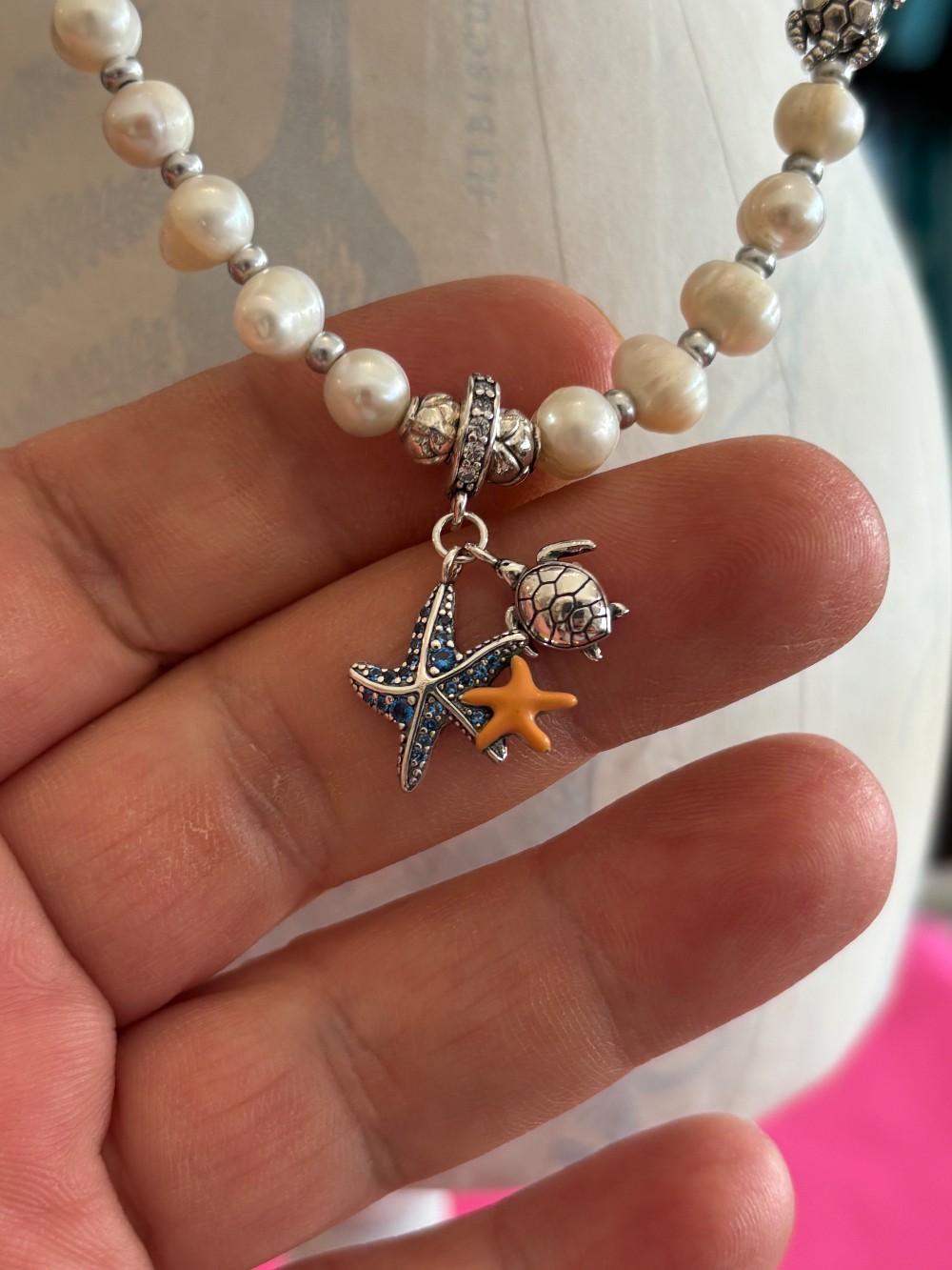Multi-color beaded necklace with faux pearls and seashell/turtle charms