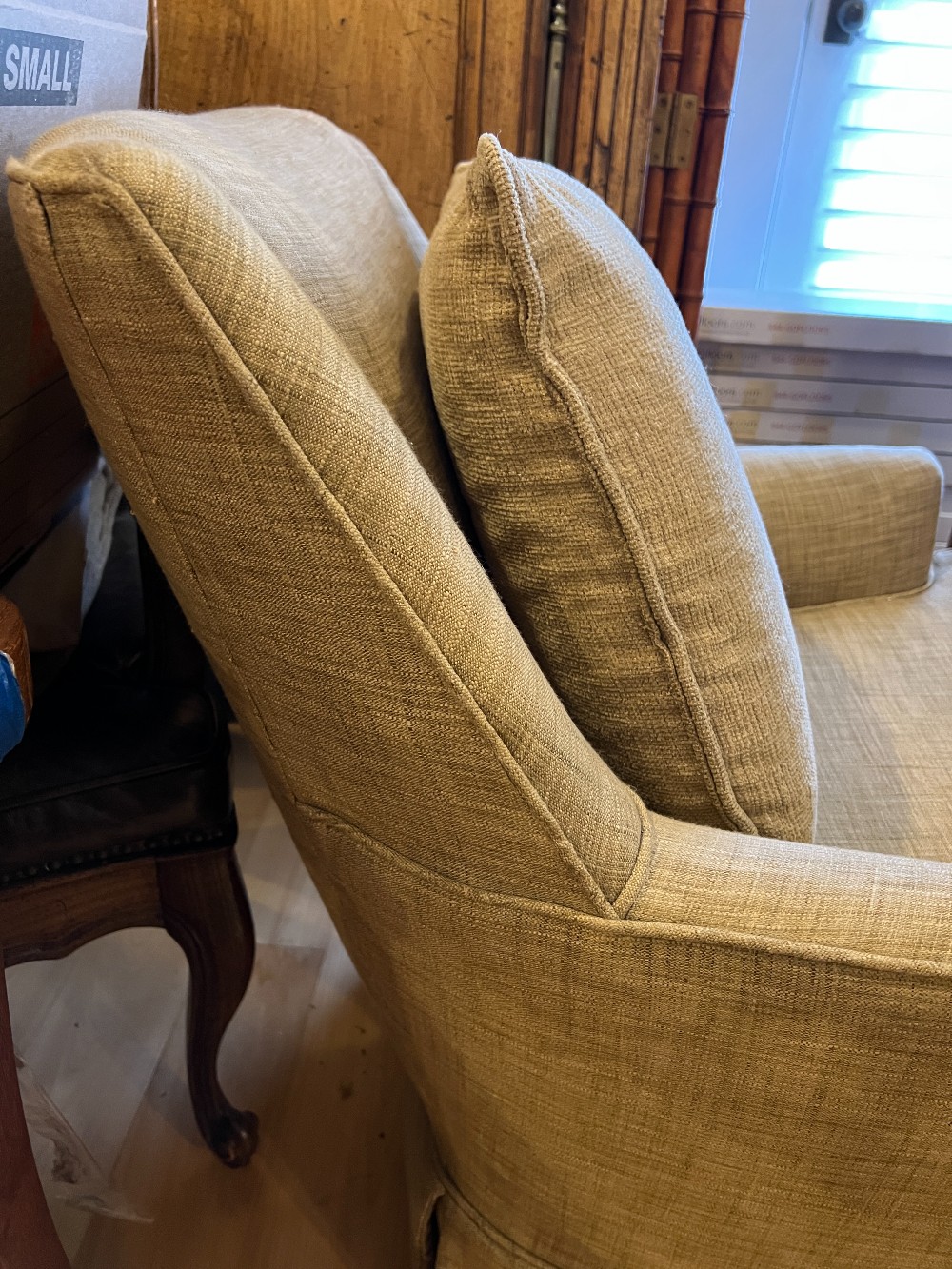 Beige Upholstered Swivel Armchair
