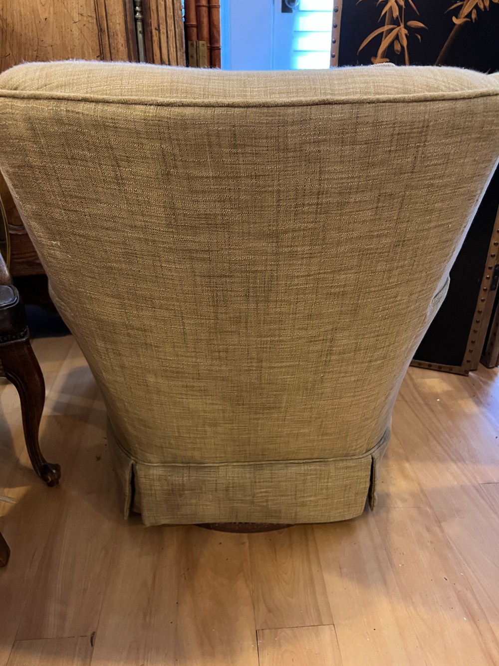 Beige Upholstered Swivel Armchair