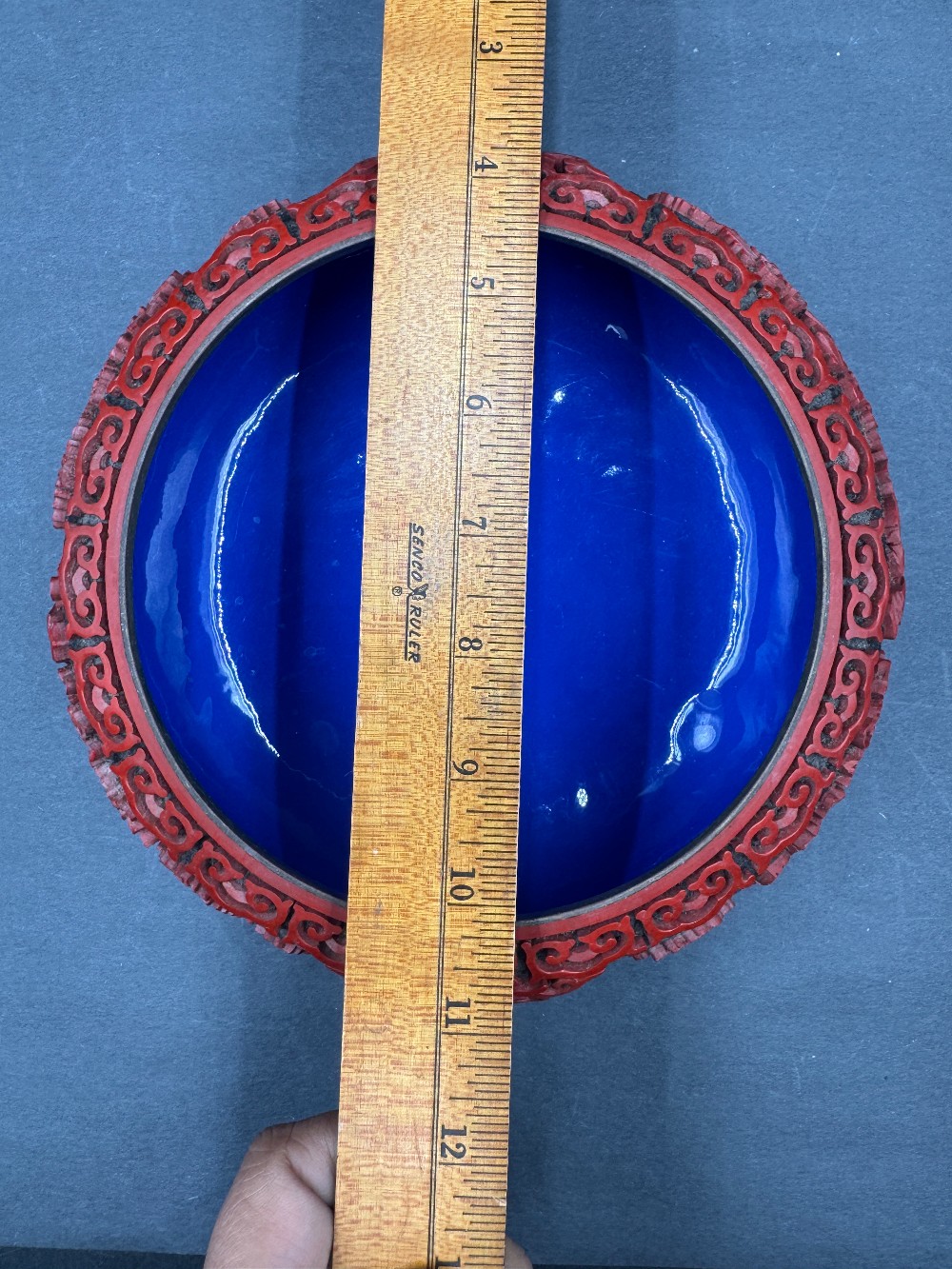 Chinese Cinnabar Style Bowl with Red Raised Carving on Black Ground, Blue Enamel Interior