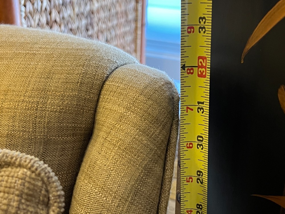 Beige Upholstered Swivel Armchair