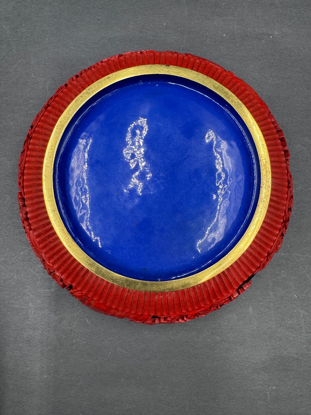 Chinese Cinnabar Style Bowl with Red Raised Carving on Black Ground, Blue Enamel Interior