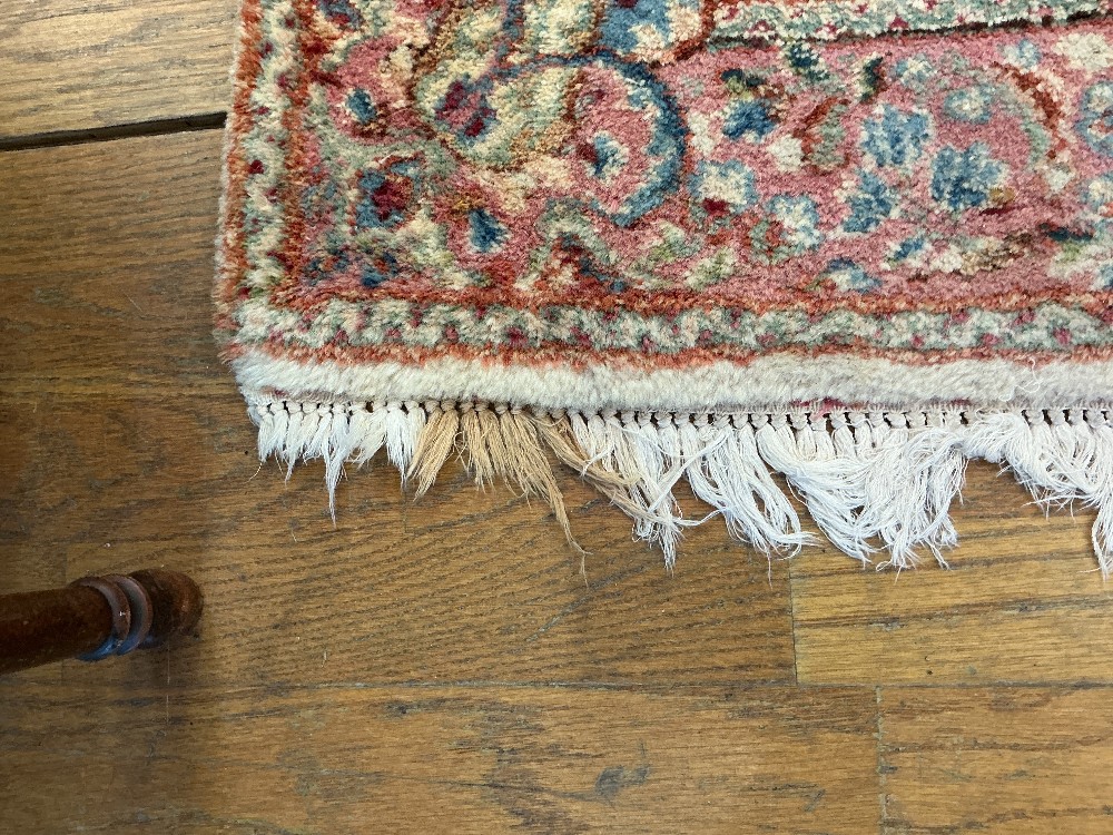 Floral, fringed, oriental area rug