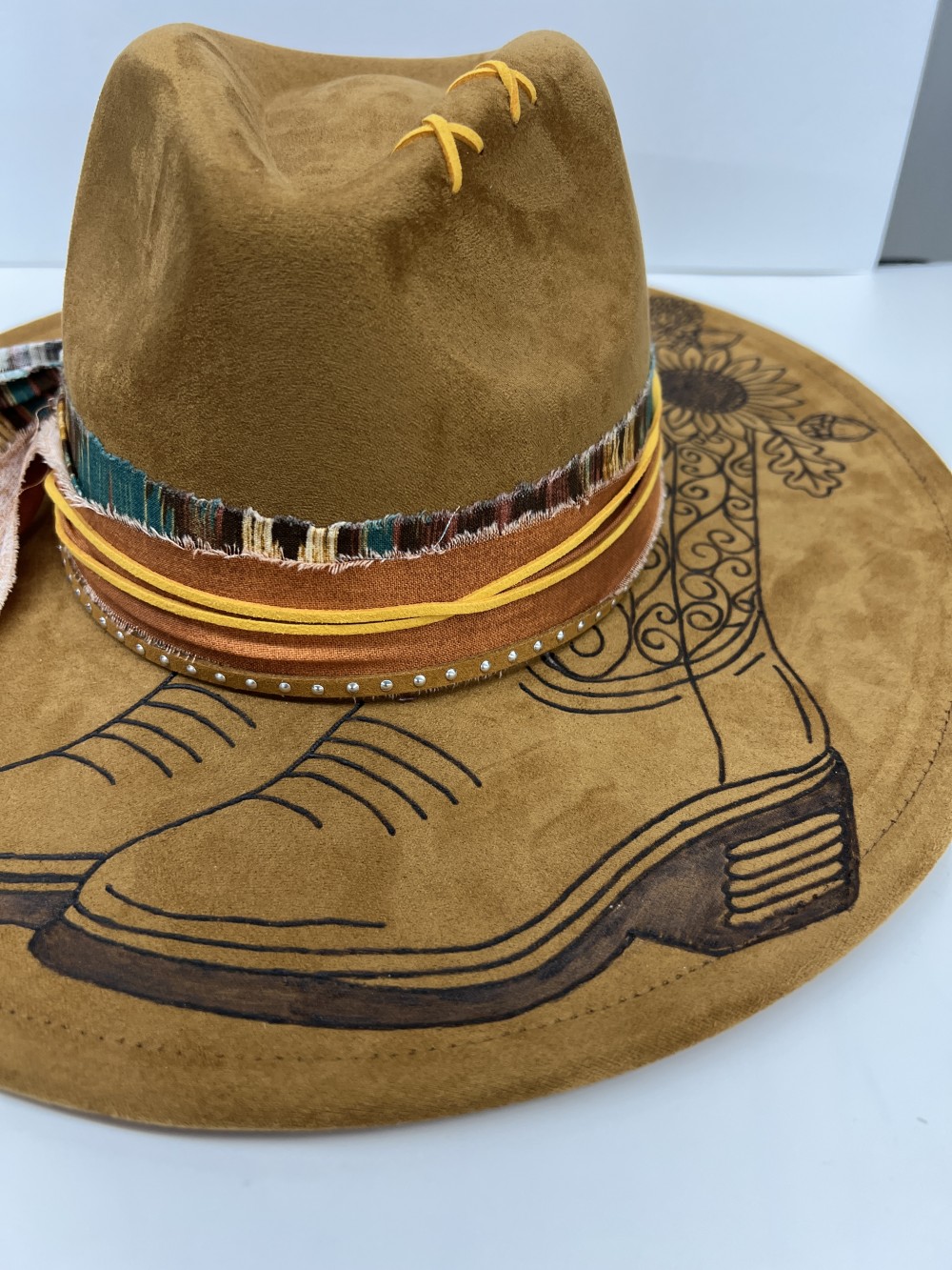 F-Fedora  med brown cowboy boot and flowers