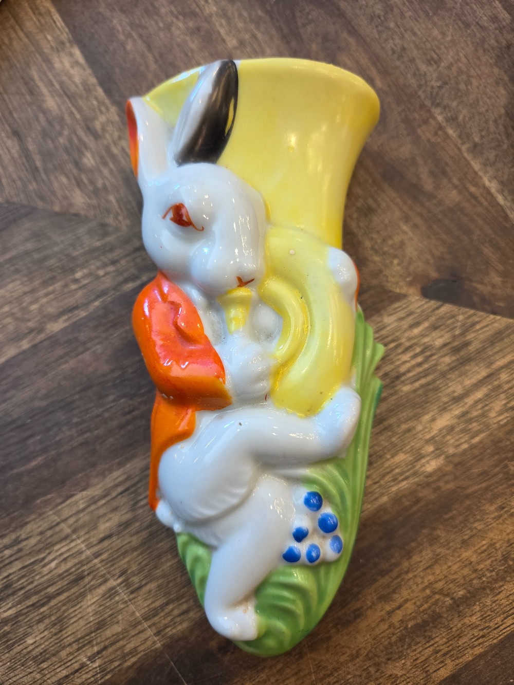 Vintage ceramic wall vase featuring a rabbit in a waistcoat playing a yellow horn, likely made in Japan