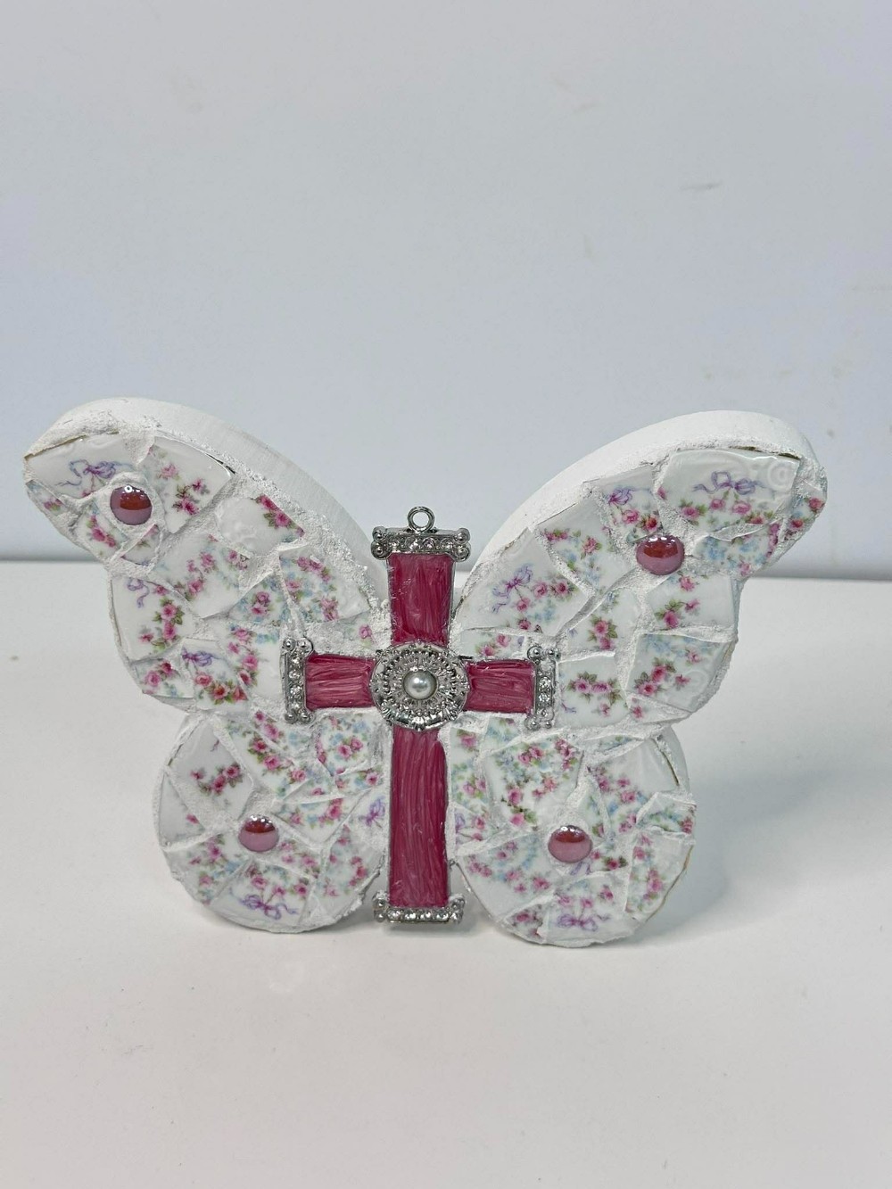 Wooden butterfly with pink cross