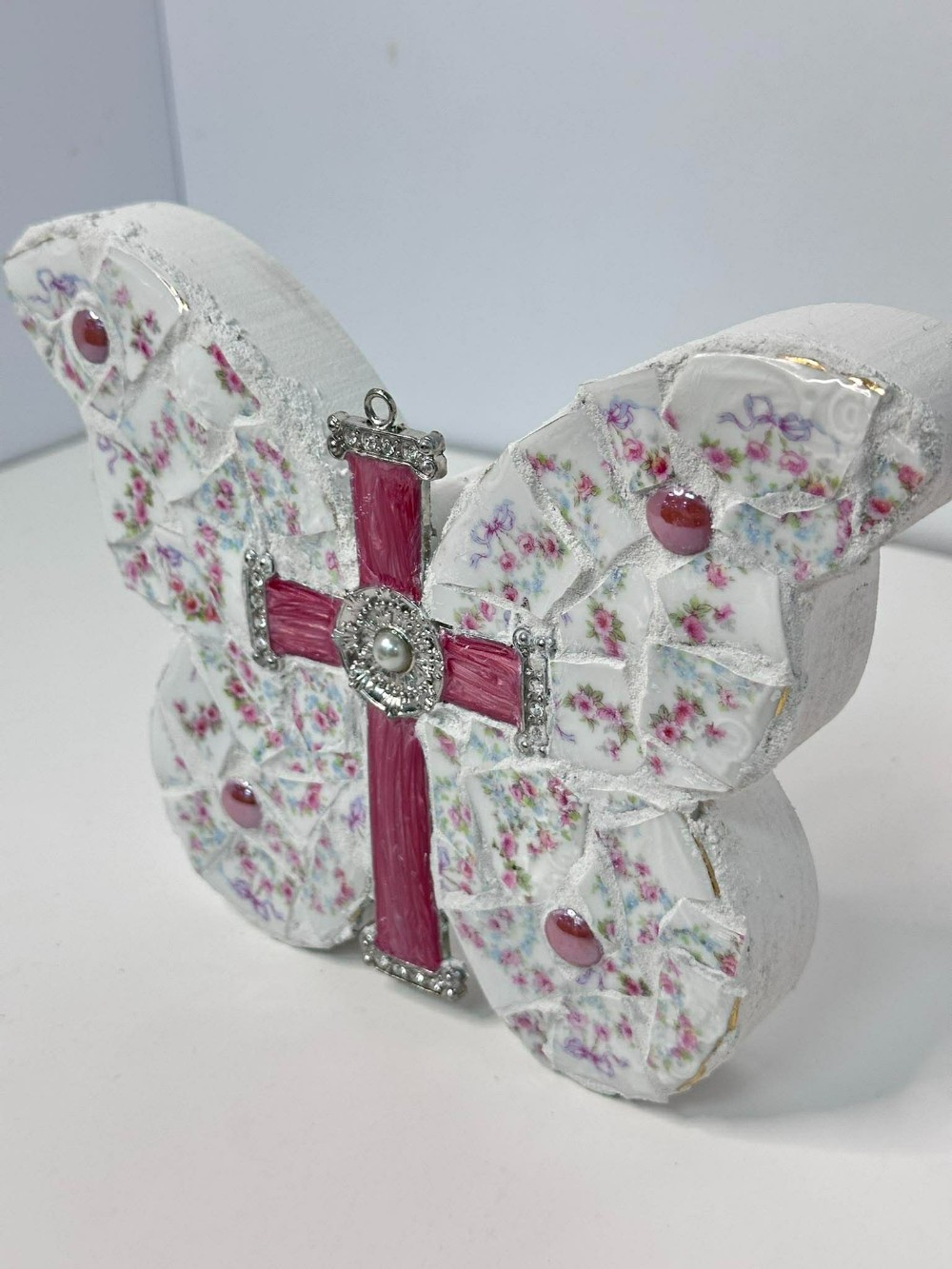Wooden butterfly with pink cross