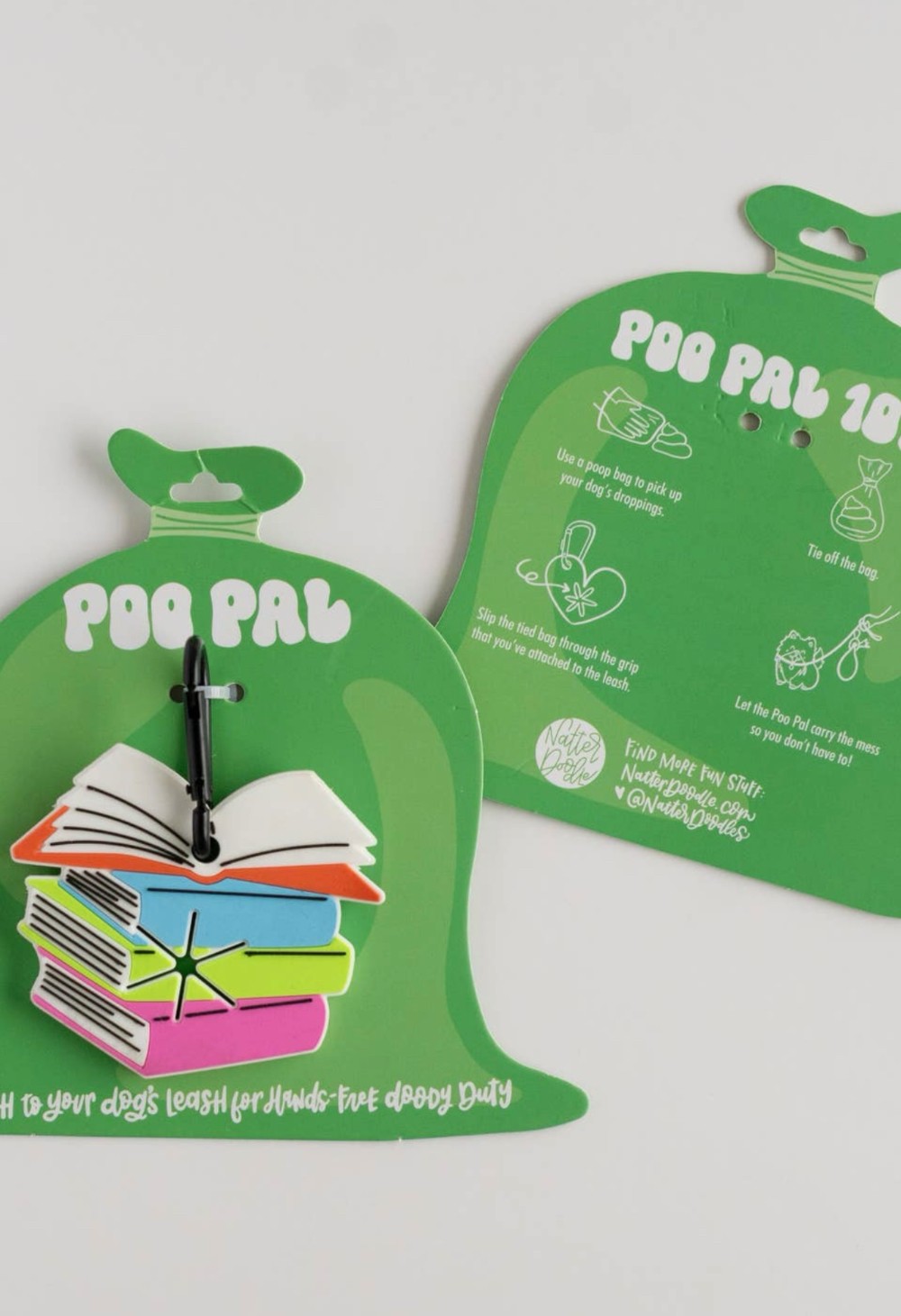 Stack of books dog poop bag holder