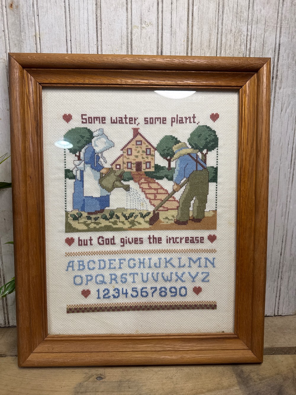 “Some Water, some plane” framed cross stitch