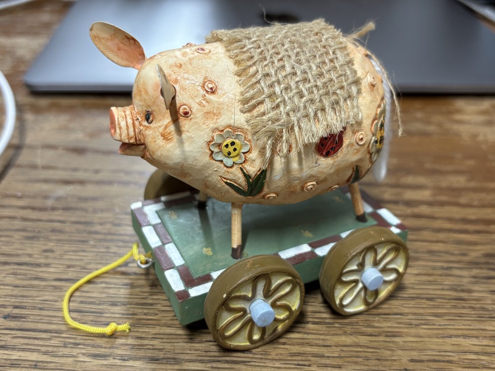 Whimsical Folk Art Pig Pull Toy on Wooden Cart