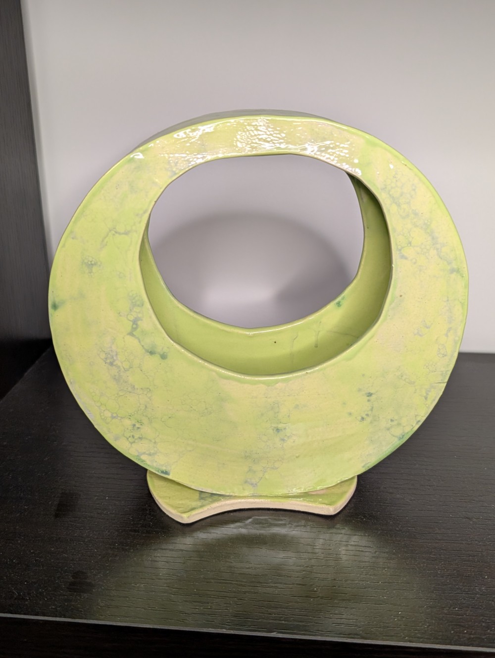 Abstract green handmade pottery piece