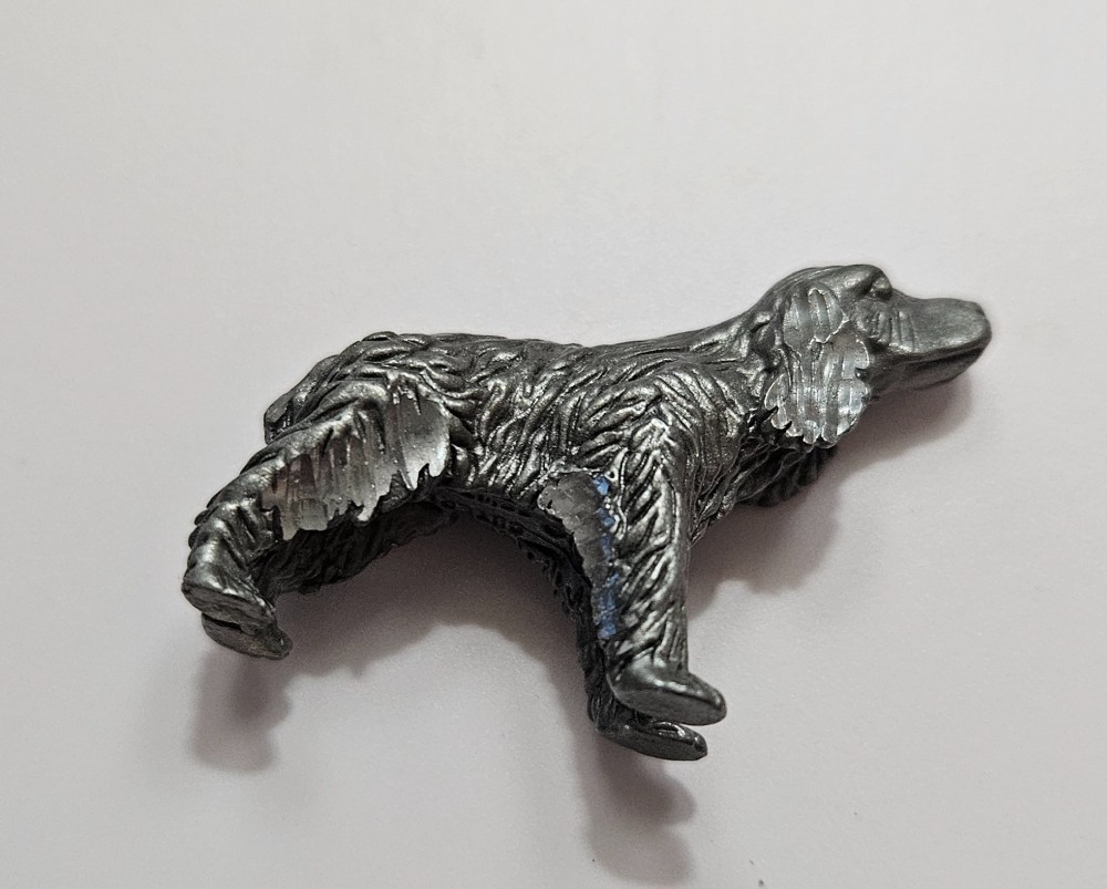 silver-tone metal spaniel figurine featuring
