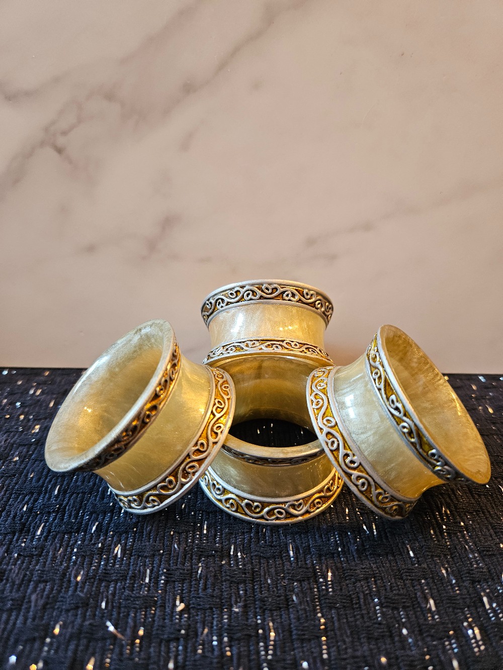 vintage Kemp & Beatley marble-effect scroll napkin rings