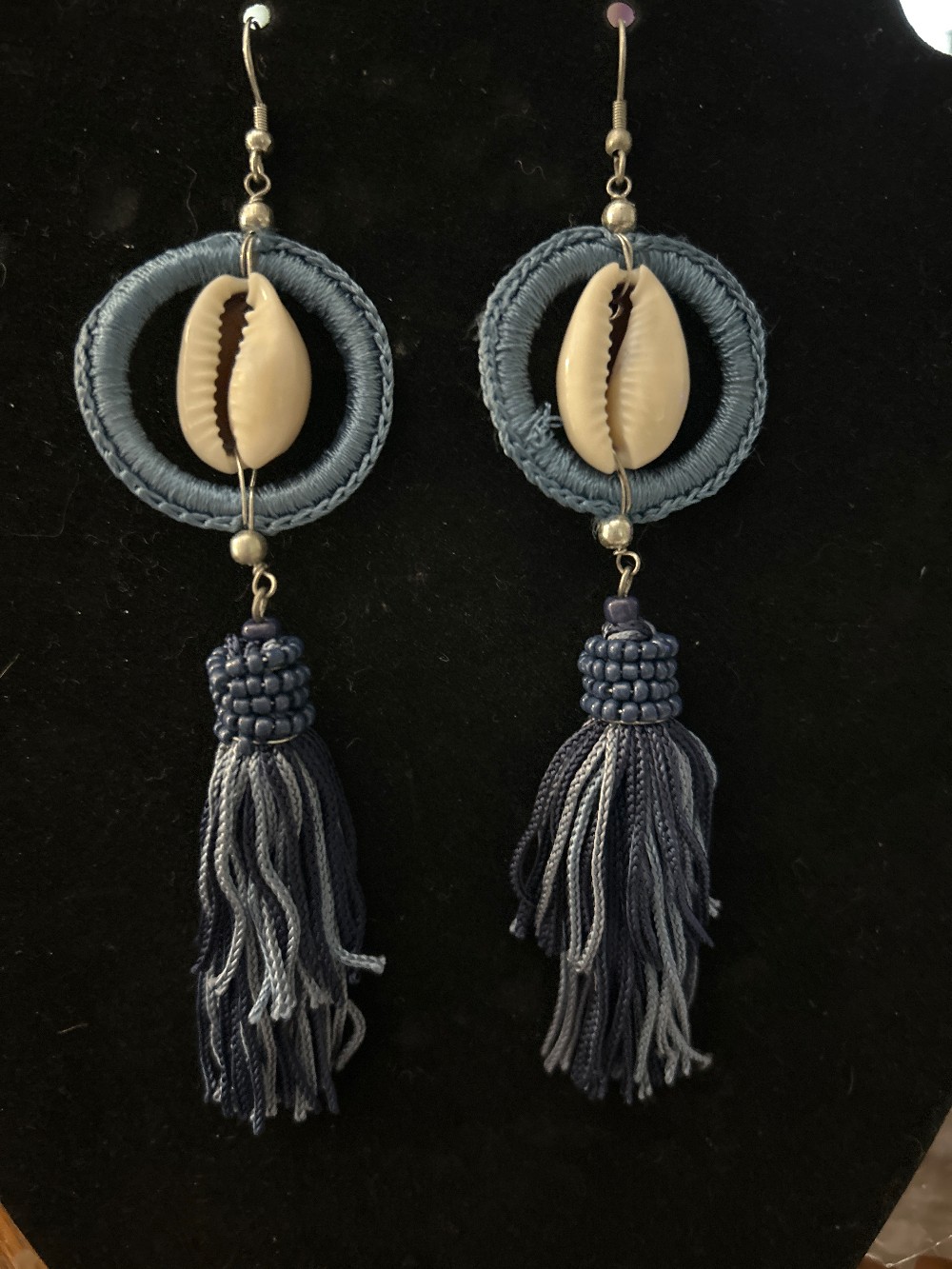 Cowrie shell earrings set in a blue woven hoop & multi-colored tassels NWT