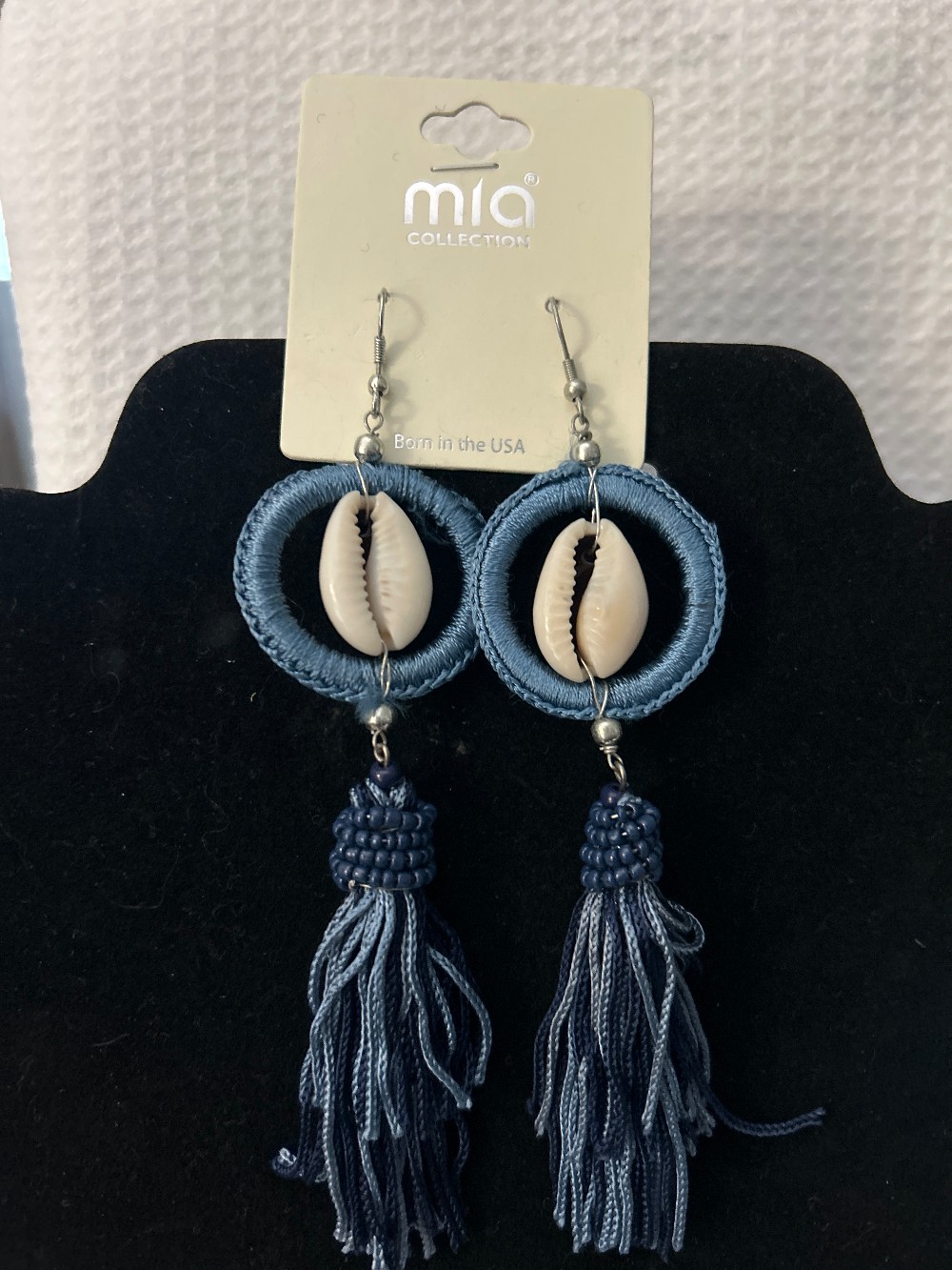 Cowrie shell earrings set in a blue woven hoop & multi-colored tassels NWT