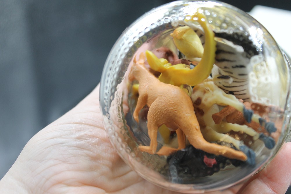 Jar of miniature wildlife animal figurines