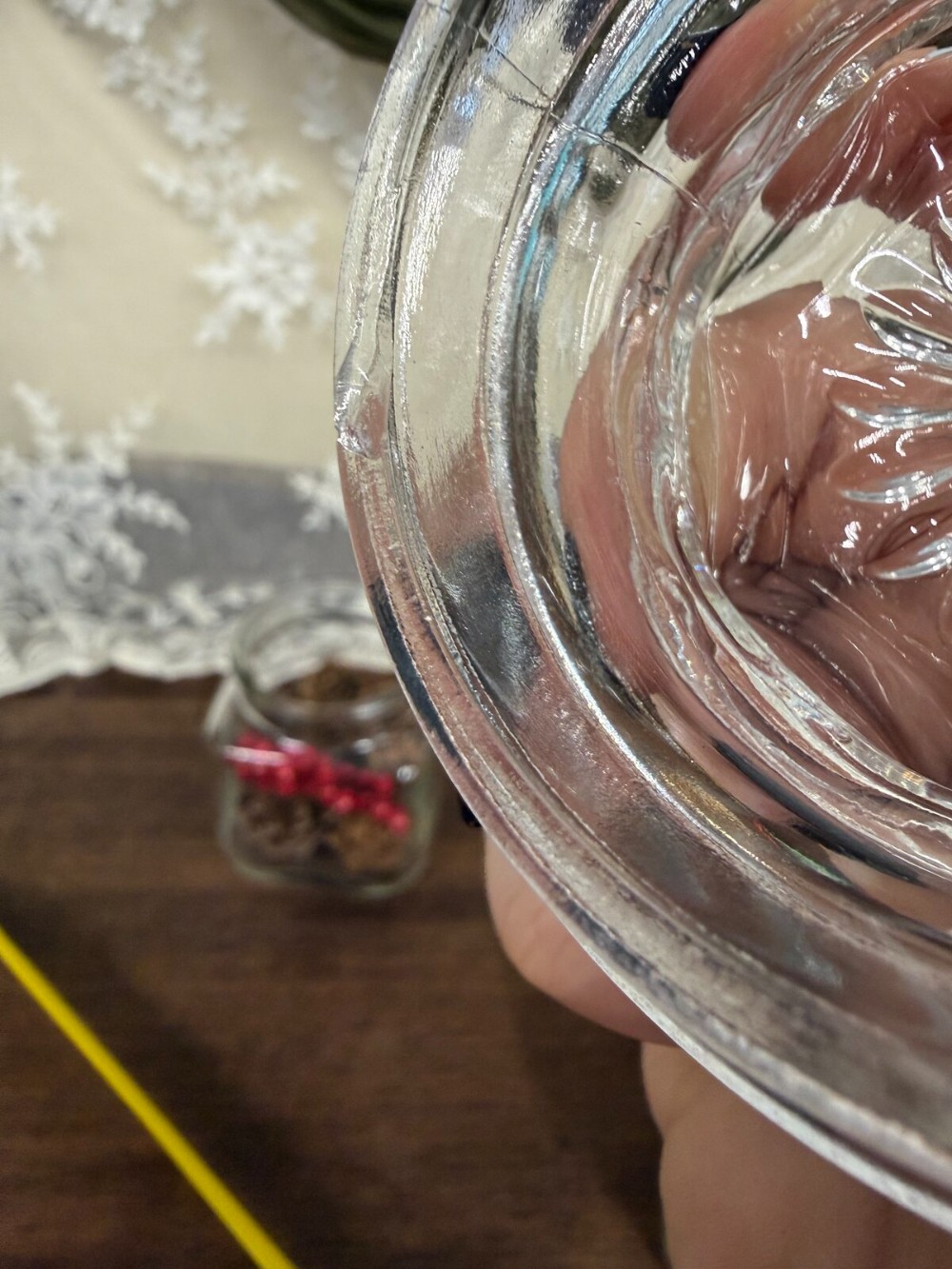 Square Glass Jar with Lid Filled with Pinecones and Red Berries
