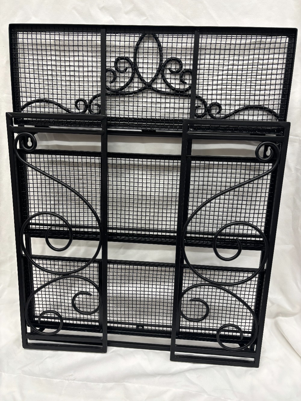 Storage Southern Livng black metal wall shelf folds flat