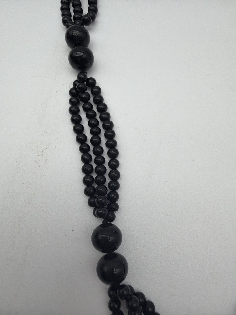 Vintage Black Glass Triple-Strand Beaded Necklace with Carved Peach Pendant
