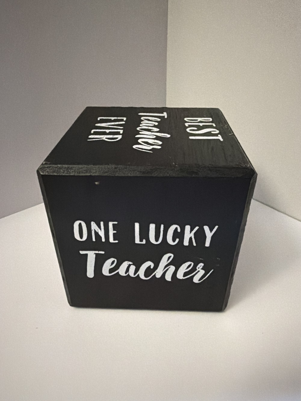 Teacher black wooden cube