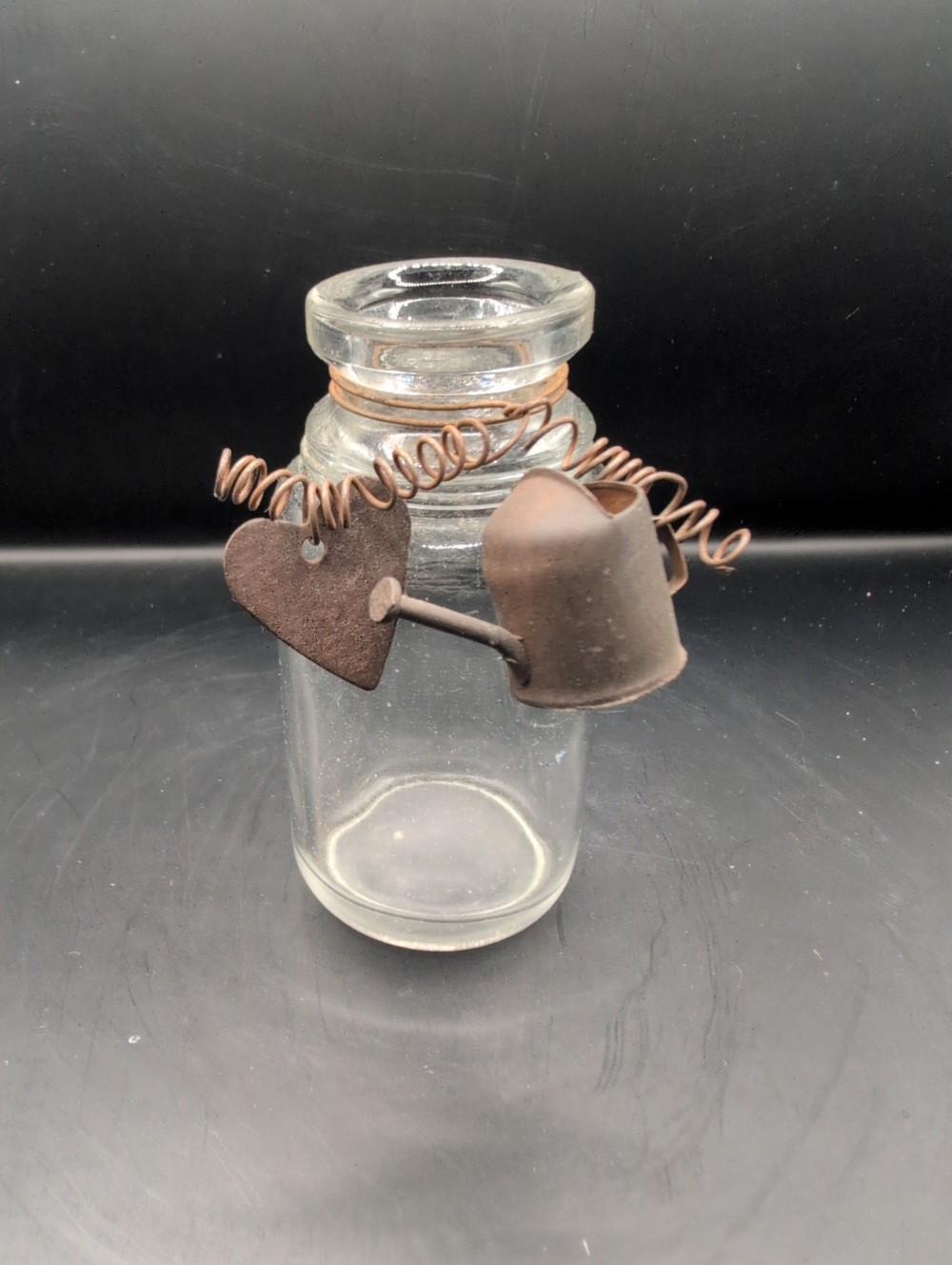 Miniature glass bottle with primitive decor