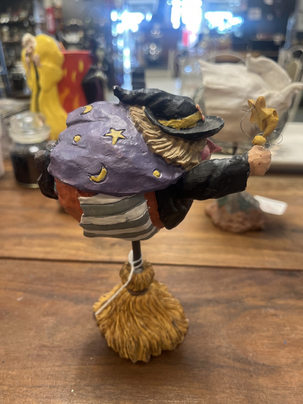 Halloween flying witch on a broomstick stand