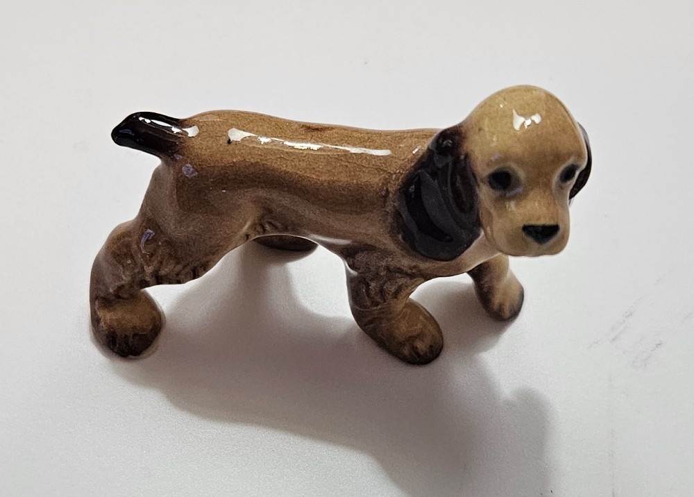 vintage ceramic miniature figurine of a walking Cocker Spaniel,