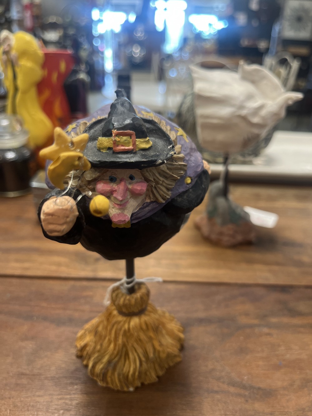 Halloween flying witch on a broomstick stand