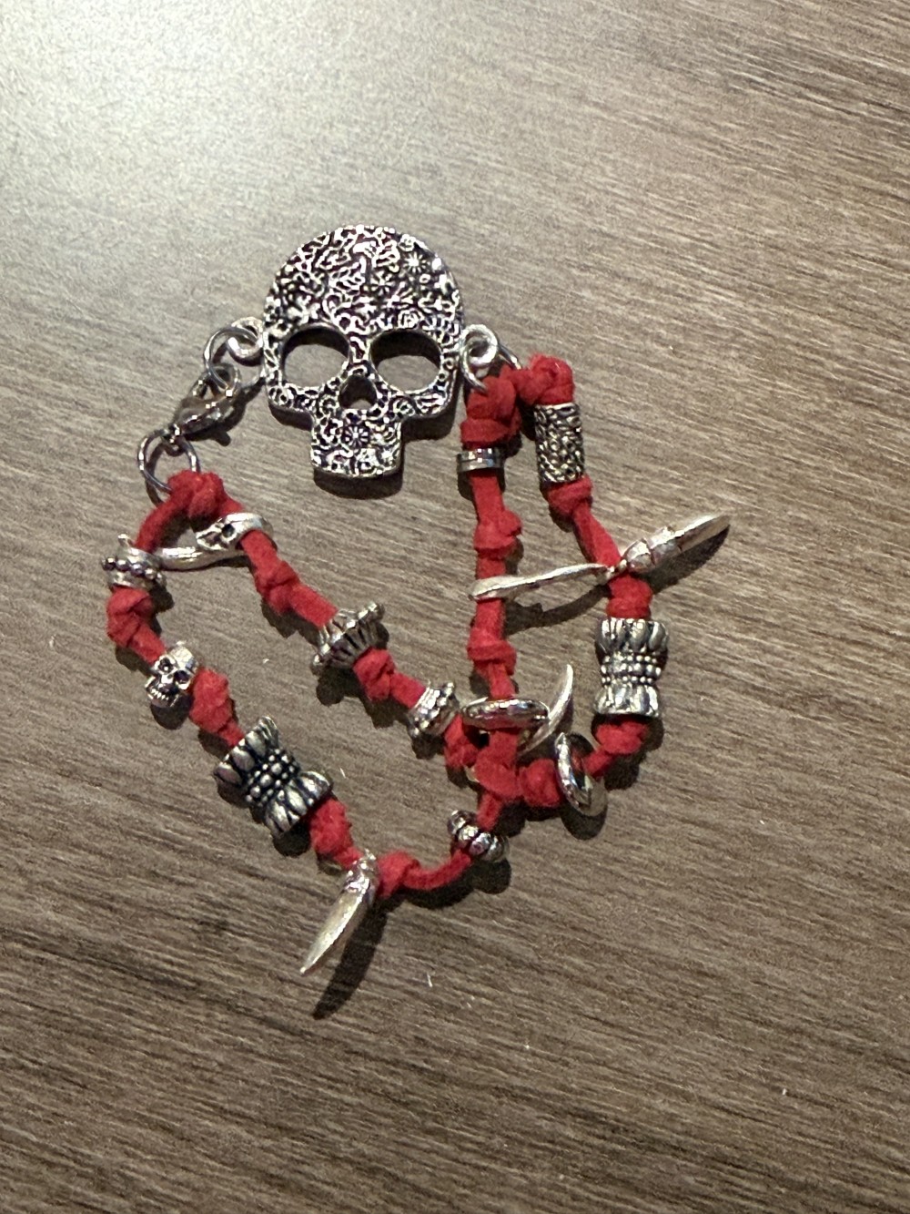 Bracelet - Silver skull Red leather bead accents