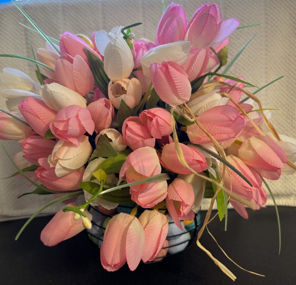 Pink, pale pink & white tulips black wire basket w/eggs