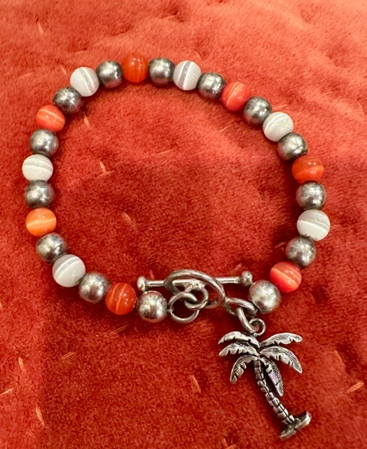 Toggle Bracelet sterling silver and orange & white cat's eye beads with sterling palm tree charm