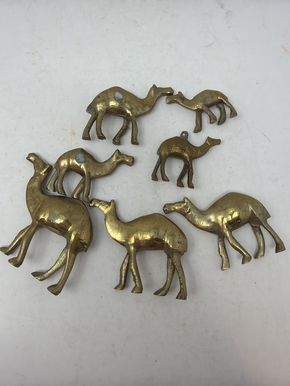 7 Mini Brass Camels in Jar