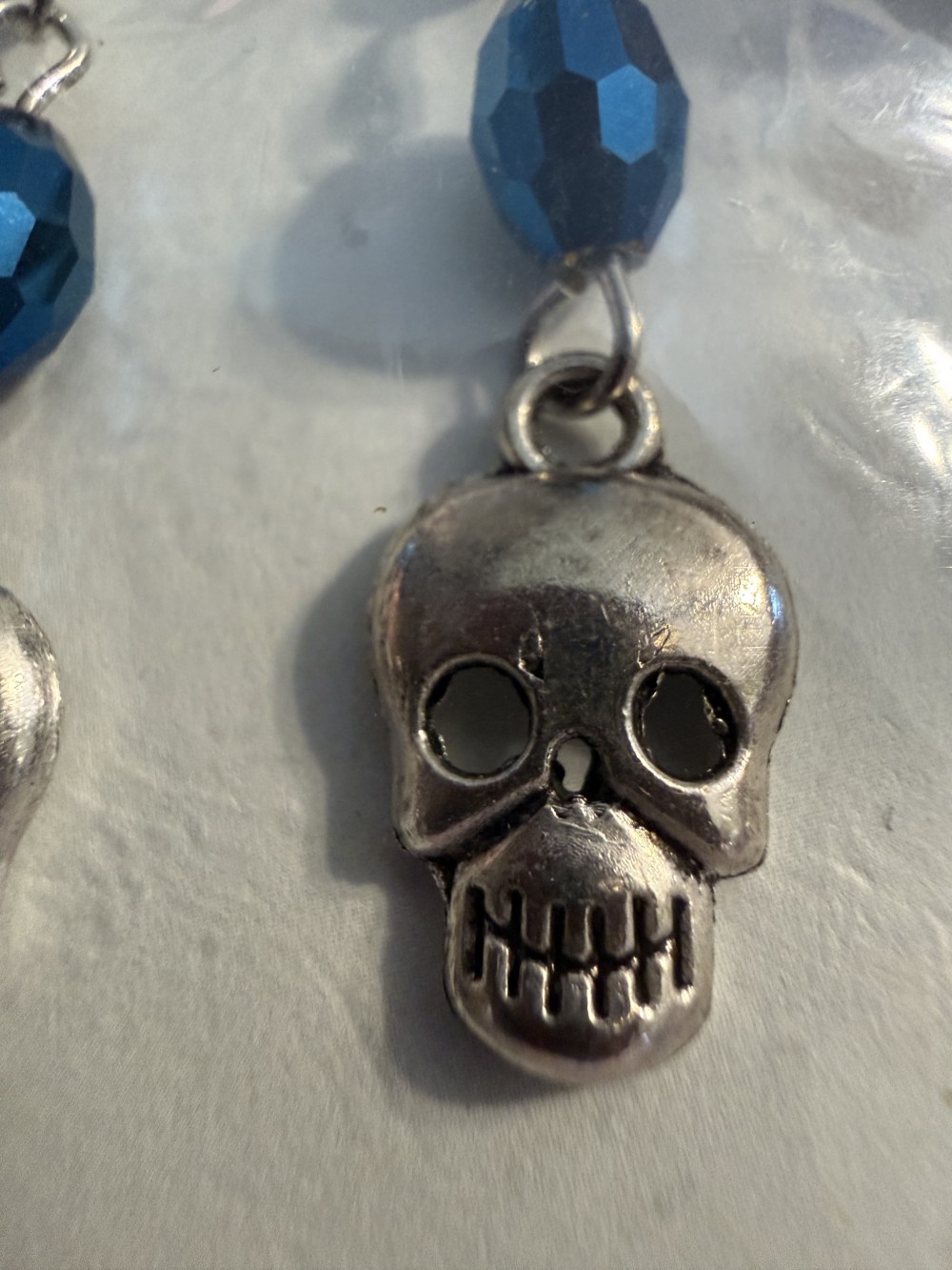 Earrings - Skull w/ Iridescent Blue Bead