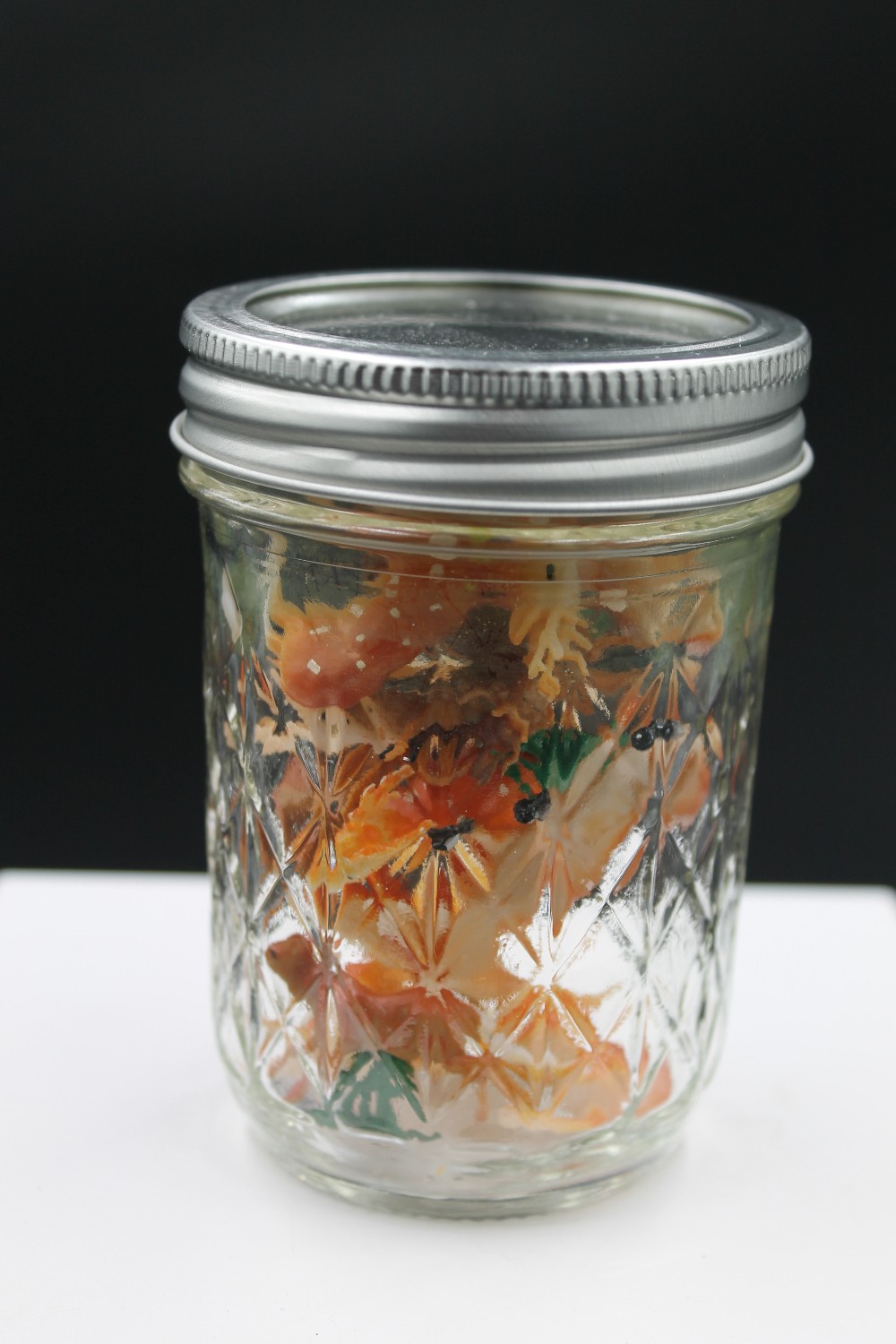 Jar of plastic miniature deer figurines