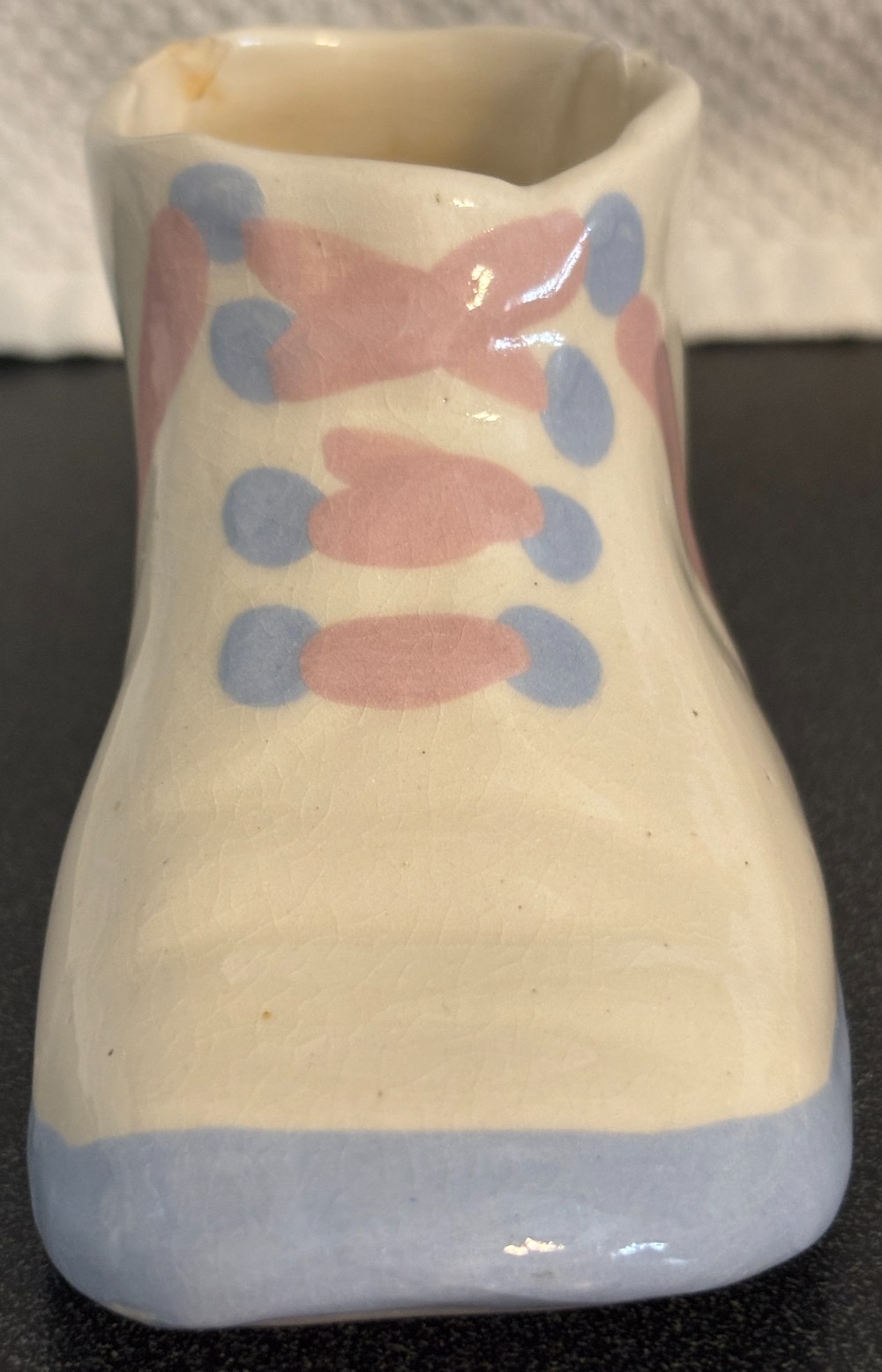 Ceramic off white baby shoe planter w/pink & blue laces