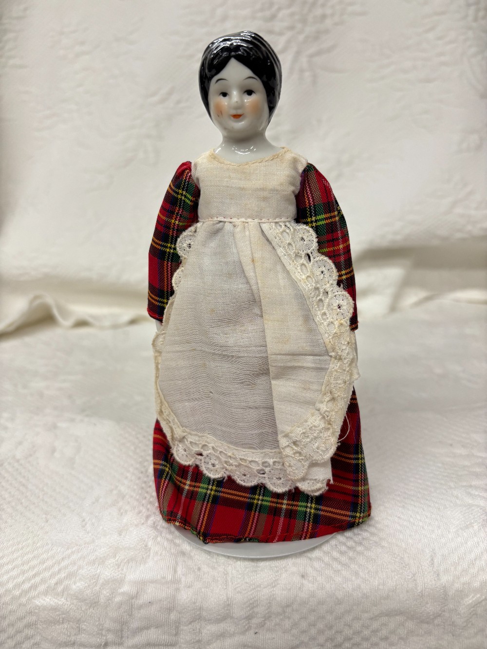 China doll black hair plaid dress w/white apron stand As is