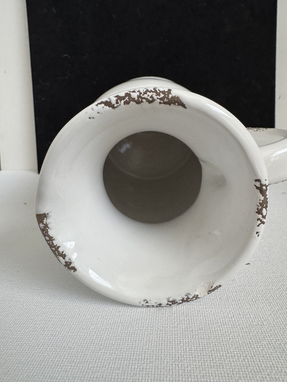 PITCHER, POTTERY CREAMER WITH DESIGNS