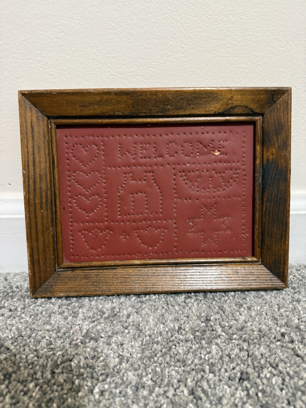 Hand punched tin welcome sign