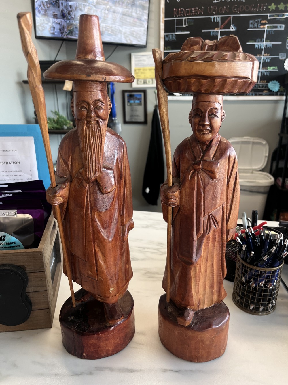 Pair of hand carved East Asian figures